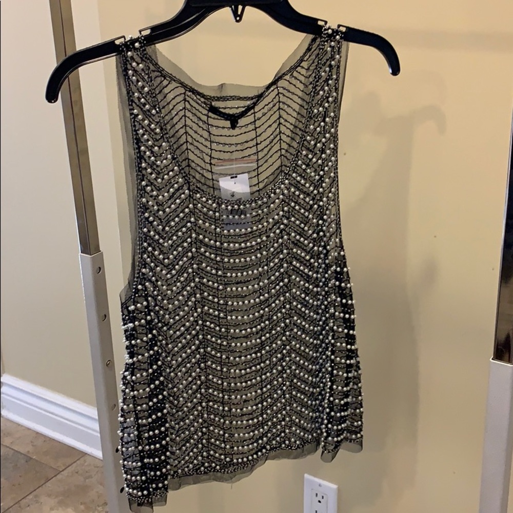 Elegant beaded shirt.